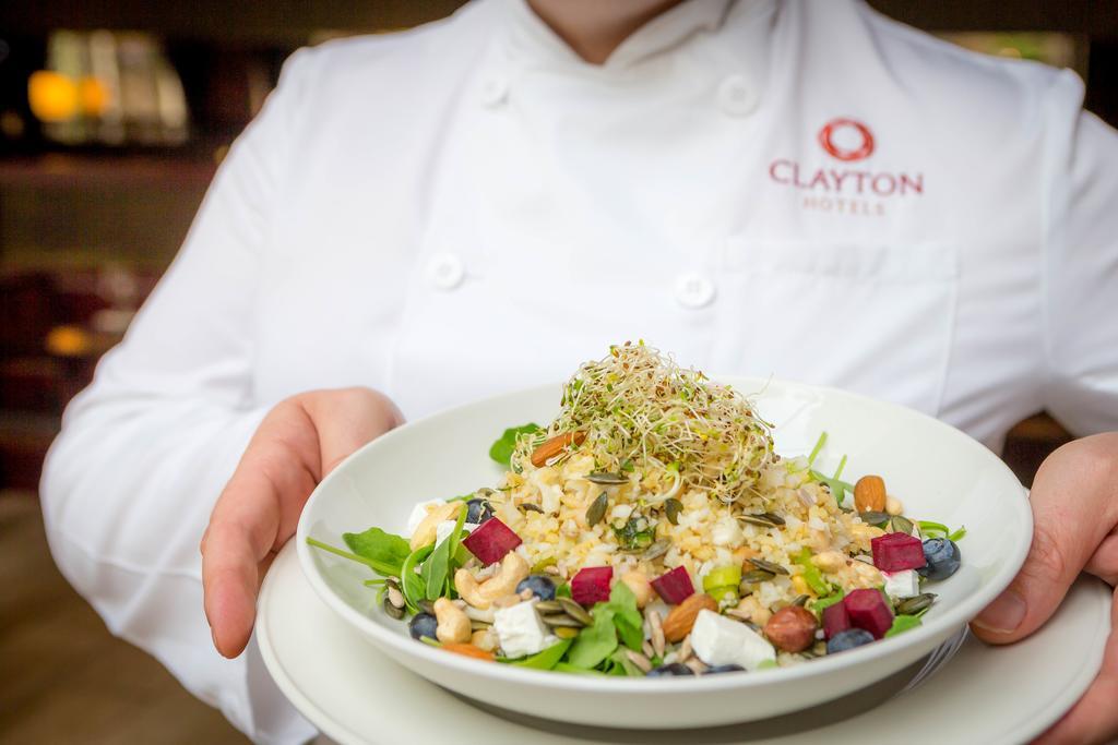 Clayton Hotel Dublin Airport Coolock Dış mekan fotoğraf Chef holding a plate of food